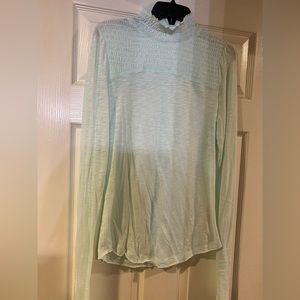 Free people top. Never worn. New without tags